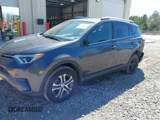 2016 Toyota RAV4 LE with VIN JTMZFREV5GJ078051, listed as a IAAI auction lot 41858381 with 97,032 mi miles and . Bid and sale history available at DreamBid. Image 6.