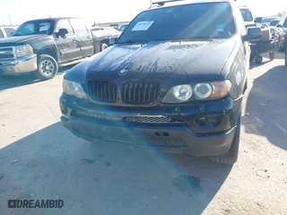 2004 BMW X5 4.4i with VIN 5UXFB53504LV06486, listed as a IAAI auction lot 41674534 with 164,974 mi miles. Bid and sale history available at carsss.com. Image 6.