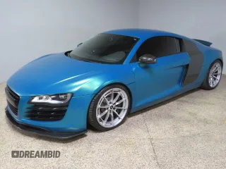 2011 Audi R8 z VIN WUAAUAFGXBN001538, wystawiony jako Copart lot #72457134 z przebiegiem 66 599 mil mil oraz Szkoda całkowita • Salvage title. Historia ofert i sprzedaży dostępna na DreamBid. Obrazek 2.
