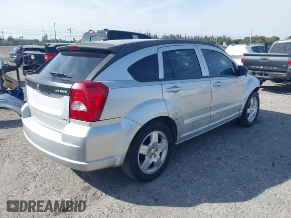 2009 Dodge Caliber SXT with VIN 1B3HB48A39D142674, listed as a IAAI auction lot 41642867 with 156,504 mi miles and . Bid and sale history available at carsss.com. Image 4.