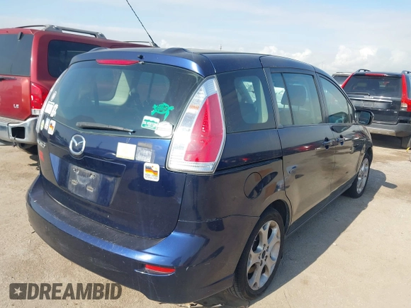 2010 Mazda 5 Sport with VIN JM1CR2W34A0380817, listed as a IAAI auction lot 42047595 with 189,592 mi miles. Bid and sale history available at carsss.com. Image 4.