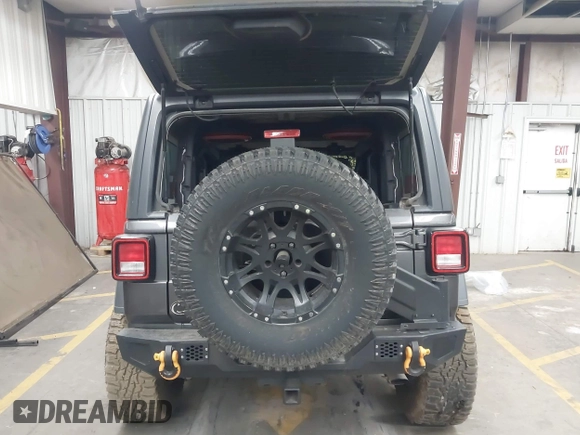 2020 Jeep Wrangler Sport S with VIN 1C4GJXAN4LW229040, listed as a IAAI auction lot 42172180 with 58,701 mi miles and . Bid and sale history available at DreamBid. Image 16.