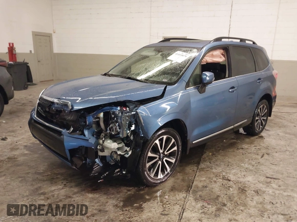 2017 Subaru Forester Touring with VIN JF2SJGTC9HH410251, listed as a IAAI auction lot 41411079 with 131,220 mi miles and . Bid and sale history available at DreamBid. Image 2.