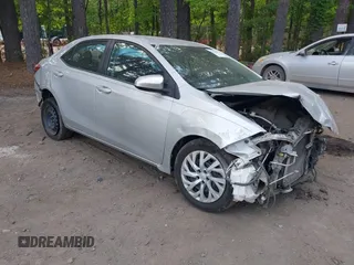 2018 Toyota Corolla L z VIN 5YFBURHE7JP812470, wystawiony jako IAAI lot #42183208 z przebiegiem 243 880 mil mil oraz . Historia ofert i sprzedaży dostępna na DreamBid. Obrazek 1.