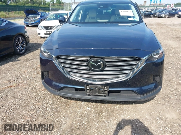 2021 Mazda CX-9 Touring with VIN JM3TCBCY7M0507699, listed as a IAAI auction lot 42603614 with 62,635 mi miles and . Bid and sale history available at DreamBid. Image 12.