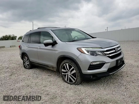 2017 Honda Pilot Touring z VIN 5FNYF6H92HB006855, wystawiony jako Copart lot #53650655 z przebiegiem 130 732 mil mil oraz Szkoda całkowita • Salvage title. Historia ofert i sprzedaży dostępna na DreamBid. Obrazek 14.