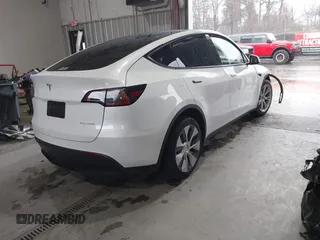 2023 Tesla Model Y Long Range z VIN 7SAYGAEEXPF789037, wystawiony jako IAAI lot #41551605 z przebiegiem 8 630 mil mil oraz . Historia ofert i sprzedaży dostępna na DreamBid. Obrazek 4.