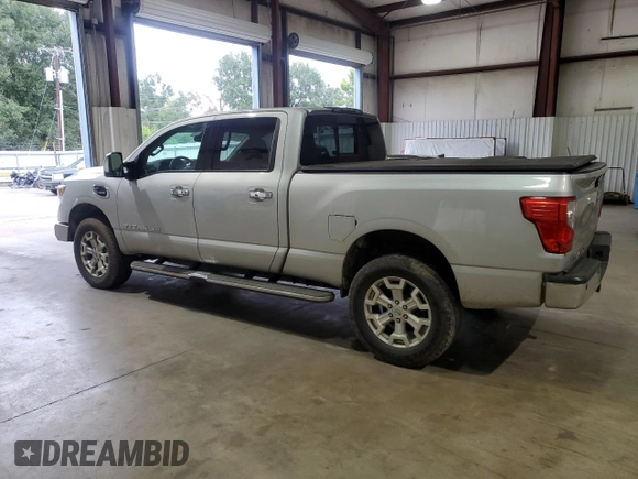 2016 Nissan Titan XD PRO-4X with VIN 1N6BA1F45GN506049, listed as a Copart auction lot 70746074 with 153,093 mi miles and Salvage Title. Bid and sale history available at carsss.com. Image 2.
