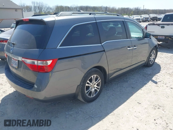 2012 Honda Odyssey EX-L with VIN 5FNRL5H69CB047425, listed as a IAAI auction lot 42064979 with 242,409 mi miles and . Bid and sale history available at carsss.com. Image 4.