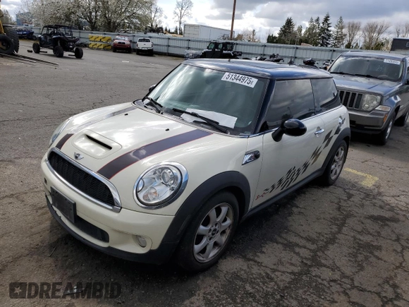 2009 MINI Hardtop S with VIN WMWMF73569TW84934, listed as a Copart auction lot 51344975 with 123,929 mi miles and Salvage title. Bid and sale history available at DreamBid. Image 1.