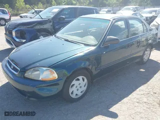1997 Honda Civic LX with VIN JHMEJ6678VS032473, listed as a IAAI auction lot 42110249 with 257,328 mi miles. Bid and sale history available at carsss.com. Image 2.
