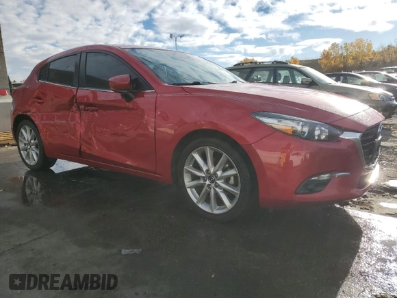 2017 Mazda 3 Grand Touring with VIN JM1BN1M37H1126947, listed as a Copart auction lot 77704214 with 70,970 mi miles and Salvage Title. Bid and sale history available at DreamBid. Image 4.