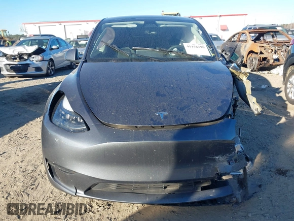 2023 Tesla Model Y Long Range with VIN 7SAYGDEE1PF647841, listed as a IAAI auction lot 41156390 with 33,473 mi miles. Bid and sale history available at carsss.com. Image 11.