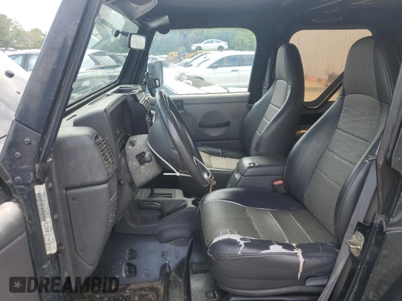 1999 Jeep Wrangler SE z VIN 1J4FY29P0XP479580, wystawiony jako Copart lot #63075455 z przebiegiem 160 986 mil mil oraz Szkoda całkowita • Salvage title. Historia ofert i sprzedaży dostępna na DreamBid. Obrazek 7.