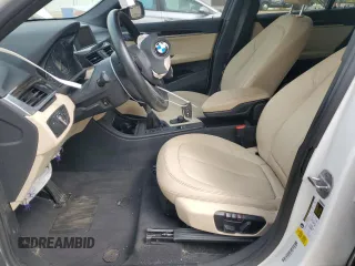 2017 BMW X1 sDrive28i with VIN WBXHU7C30H5H38049, listed as a Copart auction lot 51007915 with 52,963 mi miles and Salvage Title. Bid and sale history available at carsss.com. Image 7.