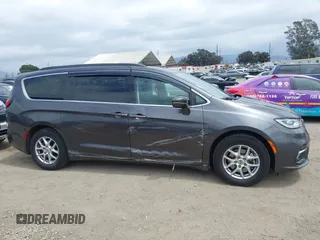 2022 Chrysler Pacifica Touring L z VIN 2C4RC1BG0NR134194, wystawiony jako IAAI lot #42082795 z przebiegiem 98 845 mil mil oraz . Historia ofert i sprzedaży dostępna na DreamBid. Obrazek 14.