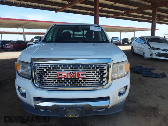 2018 GMC Canyon 4WD Denali z VIN 1GTP6EE11J1178961, wystawiony jako IAAI lot #42499884 z przebiegiem 71 309 mil mil oraz . Historia ofert i sprzedaży dostępna na DreamBid. Obrazek 12.