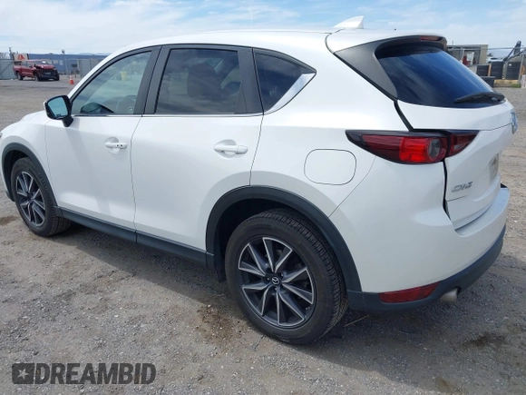 2018 Mazda CX-5 Touring with VIN JM3KFACM3J0381122, listed as a IAAI auction lot 42023838 with 76,121 mi miles. Bid and sale history available at carsss.com. Image 3.