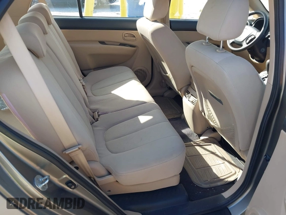 2009 Kia Rondo LX with VIN KNAFG528797267899, listed as a IAAI auction lot 42020740 with 141,113 mi miles. Bid and sale history available at carsss.com. Image 8.
