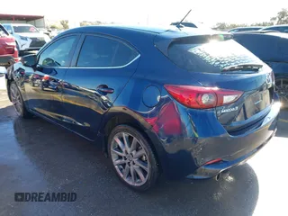2018 Mazda 3 Touring z VIN 3MZBN1L36JM238646, wystawiony jako IAAI lot #41376772 z przebiegiem 97 261 mil mil oraz . Historia ofert i sprzedaży dostępna na DreamBid. Obrazek 3.