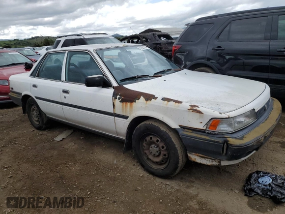 1991 Toyota Camry z VIN 4T1SV24E5MU355011, wystawiony jako Copart lot #51021185 z przebiegiem 135 881 mil mil oraz Czysty tytuł • Clean title. Historia ofert i sprzedaży dostępna na DreamBid. Obrazek 4.