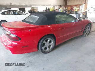 2000 Pontiac Firebird Trans Am with VIN 2G2FV32G7Y2121291, listed as a IAAI auction lot 40095437 with 140,293 mi miles. Bid and sale history available at carsss.com. Image 4.