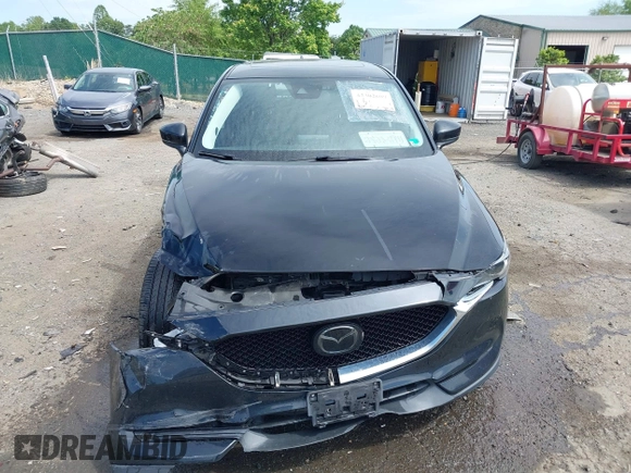 2018 Mazda CX-5 Grand Touring z VIN JM3KFBDM5J0307785, wystawiony jako IAAI lot #42302609 z przebiegiem 81 974 mil mil oraz . Historia ofert i sprzedaży dostępna na DreamBid. Obrazek 13.