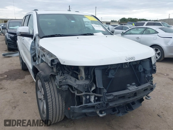 2014 Jeep Grand Cherokee Overland with VIN 1C4RJECG3EC266659, listed as a IAAI auction lot 41363419 with 142,896 mi miles. Bid and sale history available at carsss.com. Image 1.