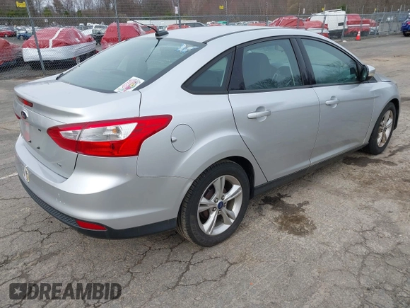 2014 Ford Focus SE with VIN 1FADP3F24EL285126, listed as a IAAI auction lot 41956143 with 113,415 mi miles. Bid and sale history available at carsss.com. Image 4.