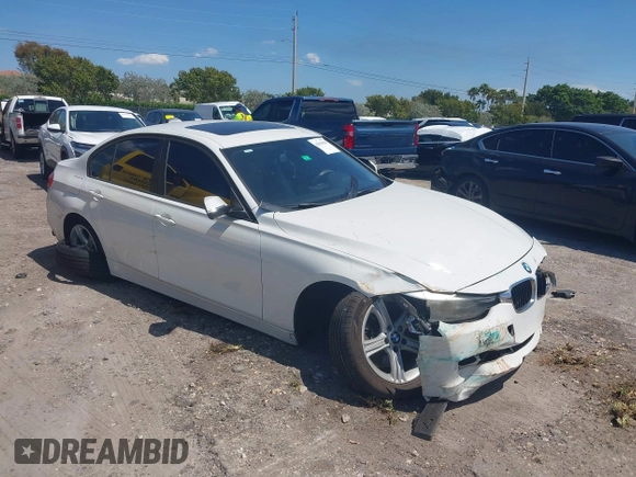 2014 BMW 3 Series 320i with VIN WBA3B1C51EK131063, listed as a IAAI auction lot 42043086 with 92,306 mi miles. Bid and sale history available at carsss.com. Image 1.