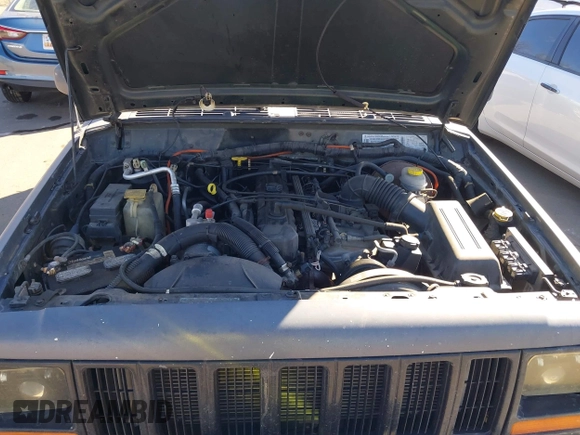 1997 Jeep Cherokee Sport with VIN 1J4FJ68S4VL567490, listed as a IAAI auction lot 41659872 with 404,766 mi miles. Bid and sale history available at carsss.com. Image 10.