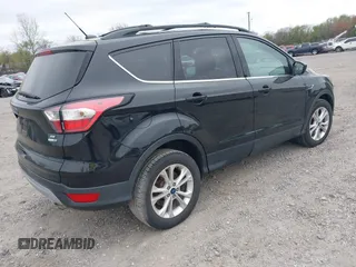 2017 Ford Escape SE with VIN 1FMCU9GD0HUC58128, listed as a IAAI auction lot 42078045 with 125,503 mi miles. Bid and sale history available at carsss.com. Image 4.
