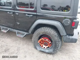 2019 Jeep Wrangler Unlimited Sport with VIN 1C4HJXDG7KW528649, listed as a IAAI auction lot 41029000 with 112,561 mi miles. Bid and sale history available at carsss.com. Image 6.