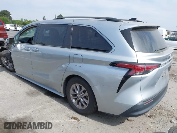 2021 Toyota Sienna LE with VIN 5TDKRKEC5MS010782, listed as a IAAI auction lot 42272827 with 196,844 mi miles and . Bid and sale history available at DreamBid. Image 3.
