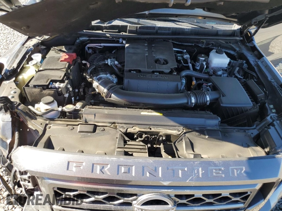 2024 Nissan Frontier SV z VIN 1N6ED1FK2RN604834, wystawiony jako Copart lot #76751104 z przebiegiem 7 788 mil mil oraz Szkoda całkowita • Salvage title. Historia ofert i sprzedaży dostępna na DreamBid. Obrazek 11.