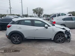 2016 Mazda CX-3 Grand Touring with VIN JM1DKDD72G0128891, listed as a IAAI auction lot 41401456 with 60,911 mi miles. Bid and sale history available at carsss.com. Image 13.