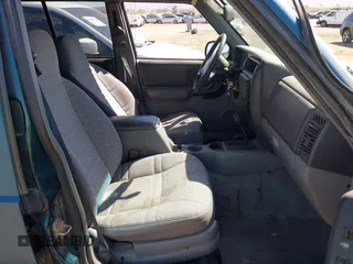 1997 Jeep Cherokee Sport with VIN 1J4FJ68S4VL592390, listed as a IAAI auction lot 41682369 with 194,624 mi miles. Bid and sale history available at carsss.com. Image 5.