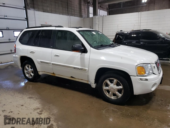 2005 GMC Envoy SLE z VIN 1GKDT13S452360609, wystawiony jako Copart lot #56188495 z przebiegiem 180 046 mil mil oraz Szkoda całkowita • Salvage title. Historia ofert i sprzedaży dostępna na DreamBid. Obrazek 4.