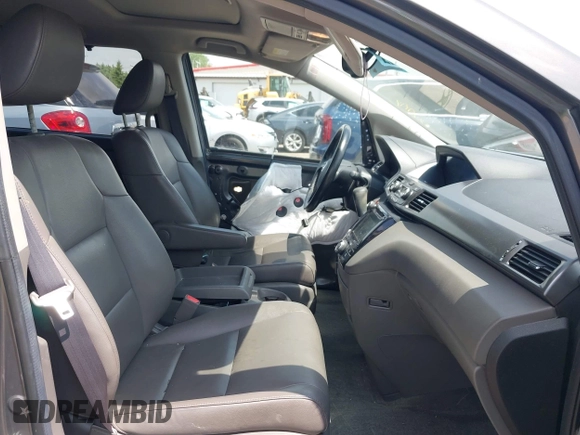 2014 Honda Odyssey EX-L z VIN 5FNRL5H64EB089875, wystawiony jako IAAI lot #42279431 z przebiegiem 107 716 mil mil oraz . Historia ofert i sprzedaży dostępna na DreamBid. Obrazek 5.
