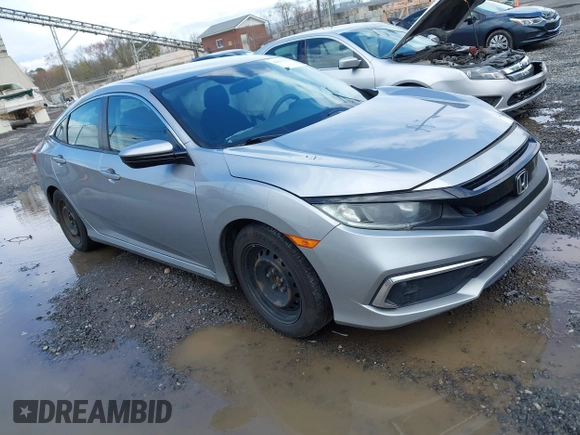 2019 Honda Civic LX with VIN 19XFC2F61KE009471, listed as a IAAI auction lot 42017532 with 81,134 mi miles and . Bid and sale history available at DreamBid. Image 1.