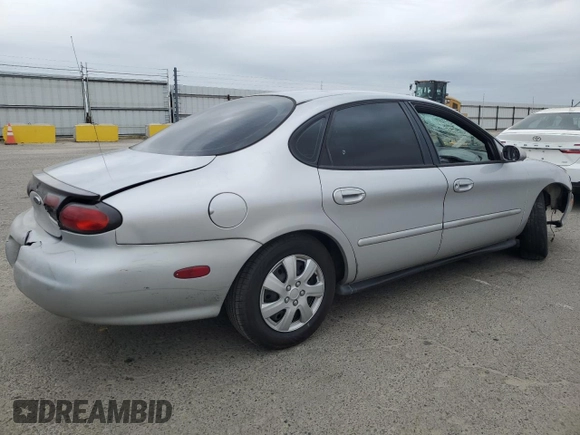 1999 Ford Taurus SE with VIN 1FAFP53U9XG290036, listed as a Copart auction lot 53505065 with 200,149 mi miles and Salvage title. Bid and sale history available at DreamBid. Image 3.