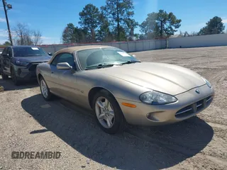 1997 Jaguar XK with VIN SAJGX2745VC008813, listed as a IAAI auction lot 41702031 with 71,601 mi miles and . Bid and sale history available at DreamBid. Image 1.