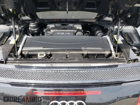 2011 Audi R8 z VIN WUAVNAFG5BN000487, wystawiony jako Copart lot #53643794 z przebiegiem 43 170 mil mil oraz Tytuł czysty. Historia ofert i sprzedaży dostępna na DreamBid. Obrazek 11.