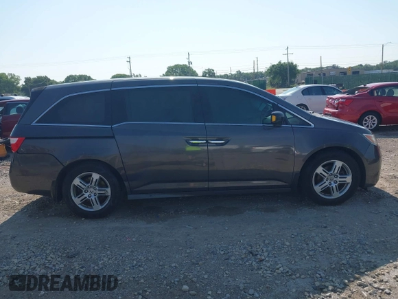 2013 Honda Odyssey Touring with VIN 5FNRL5H98DB080296, listed as a IAAI auction lot 42461843 with 104,901 mi miles and . Bid and sale history available at DreamBid. Image 13.