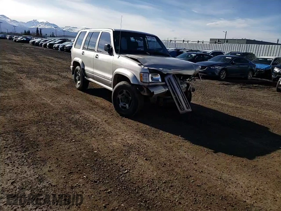1998 Isuzu Trooper S with VIN JACDJ58X2W7916707, listed as a Copart auction lot 54154335 with 167,433 mi miles and Salvage title. Bid and sale history available at DreamBid. Image 14.