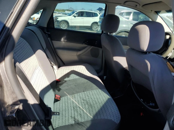 2007 Ford Focus S z VIN 1FAHP34N77W192231, wystawiony jako Copart lot #59020505 z przebiegiem 99 284 mil mil oraz Szkoda całkowita • Salvage title. Historia ofert i sprzedaży dostępna na DreamBid. Obrazek 10.