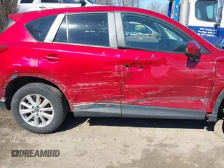 2014 Mazda CX-5 Touring with VIN JM3KE2CY2E0374440, listed as a IAAI auction lot 41634144 with 106,145 mi miles and . Bid and sale history available at DreamBid. Image 6.