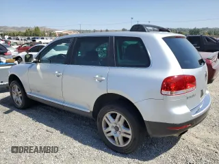 2005 Volkswagen Touareg z VIN WVGCM77L95D014940, wystawiony jako Copart lot #60156795 z przebiegiem 114 551 mil mil oraz Czysty tytuł • Clean title. Historia ofert i sprzedaży dostępna na DreamBid. Obrazek 2.