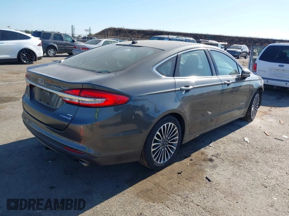 2017 Ford Fusion Hybrid SE с VIN 3FA6P0LU7HR110436, выставлен на аукционе IAAI как лот 42669395 с пробегом 104 472 миль миль и . История ставок и продаж доступна на DreamBid. Изображение 4.