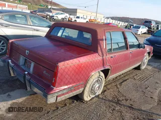 1985 Cadillac Fleetwood z VIN 1G6CB6980F4391206, wystawiony jako IAAI lot #40858339 z przebiegiem 80 251 mil mil oraz . Historia ofert i sprzedaży dostępna na DreamBid. Obrazek 4.